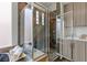 Bathroom shower featuring glass door, dual shower heads and designer tile surround at 2822 Soft Horizon Way, Las Vegas, NV 89135