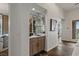 Convenient wet bar with mirrored backsplash, stylish fixtures, and easy access from the living area at 2822 Soft Horizon Way, Las Vegas, NV 89135