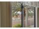A stunning backyard view of desert landscape through a sliding glass door at 3020 Ripon Dr, Las Vegas, NV 89134