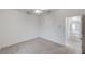 Carpeted bedroom featuring a ceiling fan, and a doorway leading to another room at 3020 Ripon Dr, Las Vegas, NV 89134
