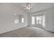 Spacious carpeted bedroom featuring a ceiling fan, a bay window, and neutral walls at 3020 Ripon Dr, Las Vegas, NV 89134