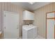 Convenient laundry room with updated appliances and storage cabinet at 3020 Ripon Dr, Las Vegas, NV 89134