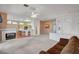 Open concept living room with breakfast bar, fireplace, and view of the front entrance and kitchen at 3020 Ripon Dr, Las Vegas, NV 89134