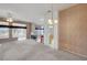 Spacious living room with a fireplace, breakfast bar, and view to the outside patio at 3020 Ripon Dr, Las Vegas, NV 89134