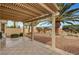 Covered patio featuring tile flooring and views of the landscaped backyard at 3020 Ripon Dr, Las Vegas, NV 89134