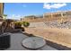 The backyard has desert landscaping, including low block walls, and a covered patio area in the background at 3362 Pheasant Canyon Way # 1005, Laughlin, NV 89029