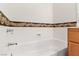 Bathroom with a tub and oak vanity at 3362 Pheasant Canyon Way # 1005, Laughlin, NV 89029