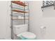 Bright bathroom featuring a toilet with shelving and a fresh, neutral color scheme at 3362 Pheasant Canyon Way # 1005, Laughlin, NV 89029