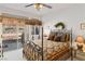 Bedroom with a four-poster bed, decorative window treatments and backyard views at 3362 Pheasant Canyon Way # 1005, Laughlin, NV 89029