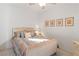 Cozy bedroom with a decorative bed frame, matching side table, and framed wall art at 3362 Pheasant Canyon Way # 1005, Laughlin, NV 89029