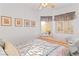 Inviting bedroom with bright natural light, complemented by framed art and stylish window treatments at 3362 Pheasant Canyon Way # 1005, Laughlin, NV 89029