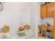 Cozy breakfast nook featuring a glass table with wicker chairs and a convenient built-in desk, ideal for casual dining at 3362 Pheasant Canyon Way # 1005, Laughlin, NV 89029