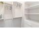 Bright walk-in closet offers varied storage solutions with shelves and hanging areas at 3362 Pheasant Canyon Way # 1005, Laughlin, NV 89029