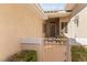 Inviting front courtyard with white gate, tile flooring, and seating area at 3362 Pheasant Canyon Way # 1005, Laughlin, NV 89029