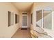 Welcoming entryway featuring tile floors, multiple windows, and a glass front door at 3362 Pheasant Canyon Way # 1005, Laughlin, NV 89029
