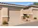 Townhome featuring neutral paint, tile roof, and low-maintenance landscaping at 3362 Pheasant Canyon Way # 1005, Laughlin, NV 89029