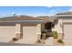 Townhome featuring neutral paint, tile roof, and low-maintenance landscaping at 3362 Pheasant Canyon Way # 1005, Laughlin, NV 89029