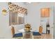 Bright laundry area with a glass table, wicker chairs, a window and white washer and dryer at 3362 Pheasant Canyon Way # 1005, Laughlin, NV 89029