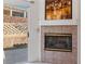 Living room with a tiled fireplace and glass sliding door leading to the backyard at 3362 Pheasant Canyon Way # 1005, Laughlin, NV 89029