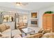 Comfortable living room featuring a fireplace, large windows and comfortable furnishings at 3362 Pheasant Canyon Way # 1005, Laughlin, NV 89029