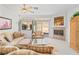 Comfortable living room featuring a fireplace, large windows and comfortable furnishings at 3362 Pheasant Canyon Way # 1005, Laughlin, NV 89029