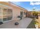 The back patio features desert landscaping, a table, and a nearby AC unit at 3362 Pheasant Canyon Way # 1005, Laughlin, NV 89029