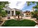 Exterior backyard view showing turf, pool and landscaped plants and shrubs at 3920 Eiderdown Pl, North Las Vegas, NV 89084