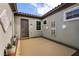 Private courtyard with decorative wall art, potted plants, and direct access to the home's entrance at 3920 Eiderdown Pl, North Las Vegas, NV 89084
