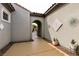 Inviting courtyard with a gated archway, showcasing a stylish and secure entrance to the home at 3920 Eiderdown Pl, North Las Vegas, NV 89084