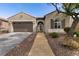 Attractive single-story home with well-maintained landscaping, two-car garage, and inviting walkway at 3920 Eiderdown Pl, North Las Vegas, NV 89084
