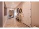 Inviting foyer with tile flooring, neutral tones and seamless access to other rooms in the house at 3920 Eiderdown Pl, North Las Vegas, NV 89084