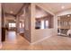 Spacious hallway with tile flooring and neutral walls, connecting various rooms in the home at 3920 Eiderdown Pl, North Las Vegas, NV 89084