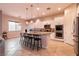 Open-concept kitchen with a large island, stainless steel appliances, white cabinets, and pendant lighting at 3920 Eiderdown Pl, North Las Vegas, NV 89084
