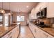 Well-lit kitchen with granite countertops, stainless steel appliances, and tile flooring at 3920 Eiderdown Pl, North Las Vegas, NV 89084