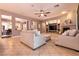 Spacious living room with a ceiling fan and fireplace at 3920 Eiderdown Pl, North Las Vegas, NV 89084