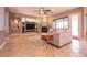 Inviting living room featuring a fireplace, comfortable seating, built-in shelving, and large windows for ample light at 3920 Eiderdown Pl, North Las Vegas, NV 89084