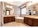 Luxurious bathroom featuring double vanities and a large soaking tub at 3920 Eiderdown Pl, North Las Vegas, NV 89084