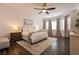 Beautiful bedroom with a ceiling fan, bay window, and modern neutral decor at 3920 Eiderdown Pl, North Las Vegas, NV 89084