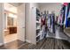 View from closet to bathroom featuring vanity and large soaking tub at 3920 Eiderdown Pl, North Las Vegas, NV 89084