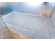 Large soaking tub offers relaxation with jacuzzi jets and elegant marble surround at 4381 W Flamingo Rd # 2605, Las Vegas, NV 89103