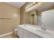 This bathroom features double sinks, a large mirror, and vanity lighting at 4685 Apulia Dr # 202, North Las Vegas, NV 89084