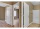 A bathroom and bedroom are connected by a set of doors, new floors and color scheme at 4685 Apulia Dr # 202, North Las Vegas, NV 89084