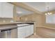 A kitchen sink is featured with view to the eating area with new wood-look floors at 4685 Apulia Dr # 202, North Las Vegas, NV 89084