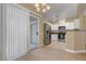The open-concept living and dining areas boast hardwood floors, neutral walls, and bright lighting at 4685 Apulia Dr # 202, North Las Vegas, NV 89084