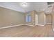 Well-lit living room features hardwood floors, neutral walls, and modern fixtures at 4685 Apulia Dr # 202, North Las Vegas, NV 89084