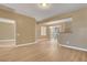 Spacious living room featuring light hardwood floors, neutral walls, and natural light at 4685 Apulia Dr # 202, North Las Vegas, NV 89084