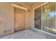Private patio with sliding glass door, wall mounted light fixture at 4685 Apulia Dr # 202, North Las Vegas, NV 89084