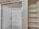 The shower in this bathroom features a glass door and built-in shelving at 4685 Apulia Dr # 202, North Las Vegas, NV 89084