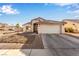 Charming single-story home with a two-car garage, desert landscaping, and a paved driveway at 5019 Cactus Mesa Way, North Las Vegas, NV 89031