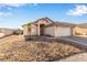 Charming single-story home with desert landscaping and a two-car garage at 5019 Cactus Mesa Way, North Las Vegas, NV 89031